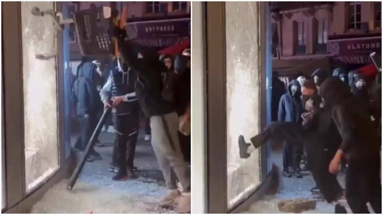 Protesters try to smash a shop window in France
