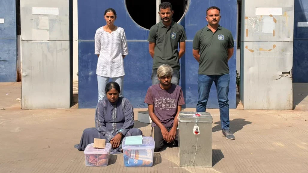 Police with the seized contraband and the arrested accused