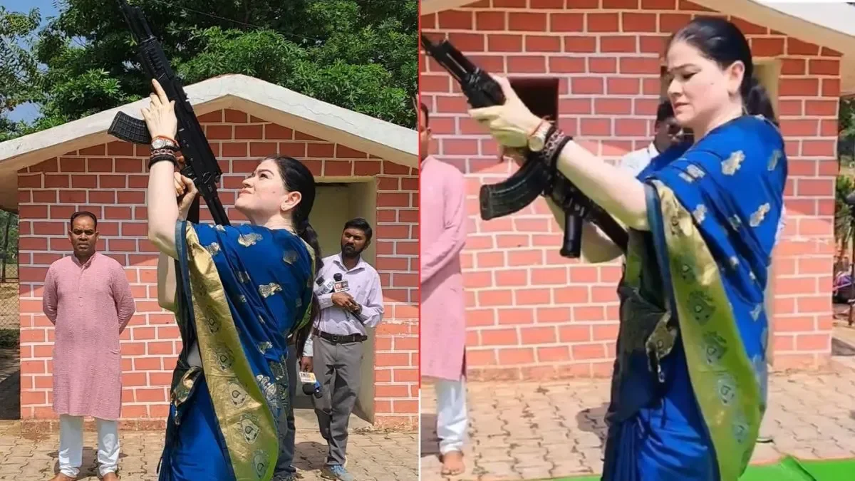 IPS Ankita Sharma handles an AK-47 during Dussehra Shastra Puja at Rajnandgaon Police Lines