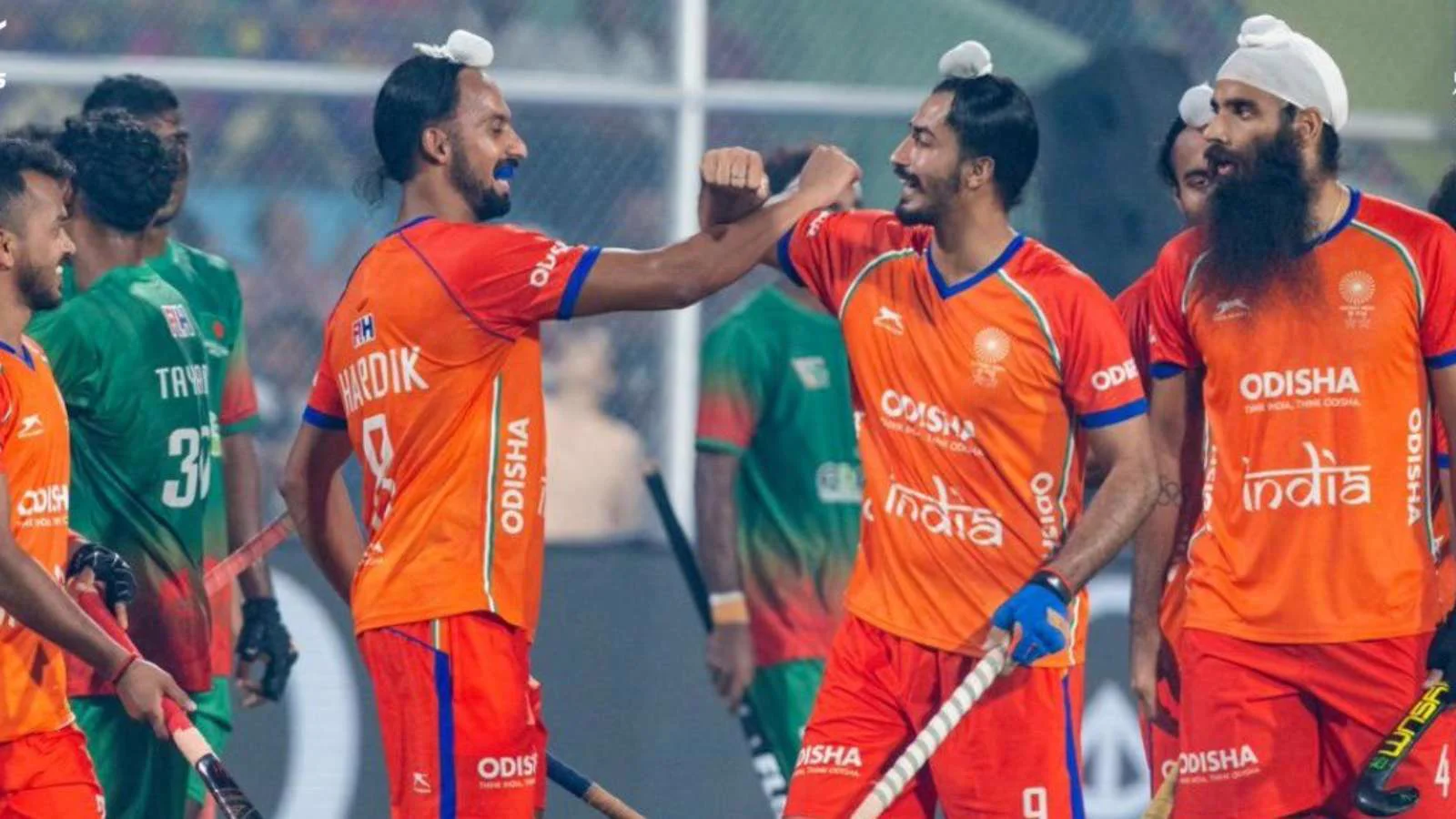 India hockey team players celebrate against Bangladesh